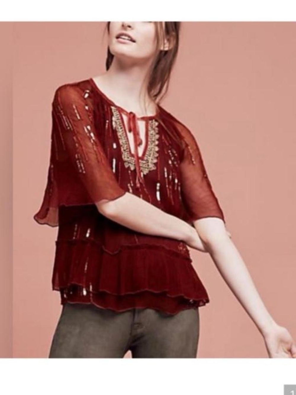 Anthropologie burgundy blouse with silver sequin embellishments and ruffled hem